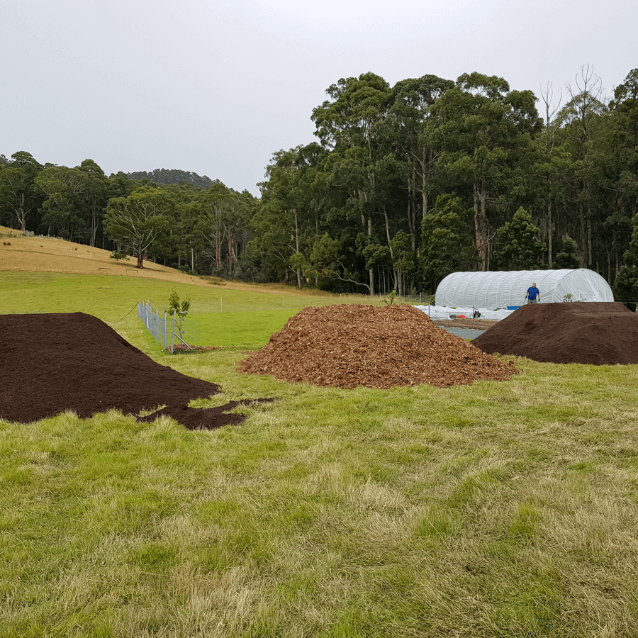 Piles of compost and tree mulch
